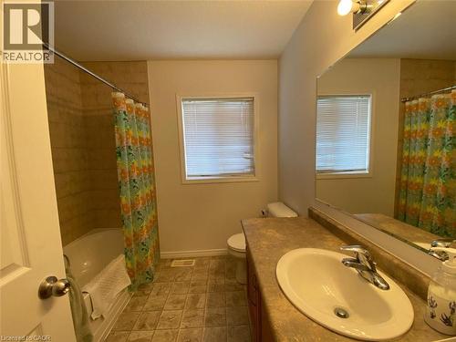 Bathroom featuring a vanity with an integrated sink, a large mirror, and overhead lighting - 287 Westmeadow Drive, Kitchener, ON - Indoor Photo Showing Bathroom