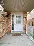 Inviting front entrance featuring a white panel door with glass inserts, sidelight, and an overhead soffit - 287 Westmeadow Drive, Kitchener, ON  - Outdoor With Deck Patio Veranda With Exterior 