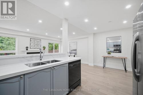 5057 Churchill Meadows Boulevard, Mississauga, ON - Indoor Photo Showing Kitchen With Double Sink