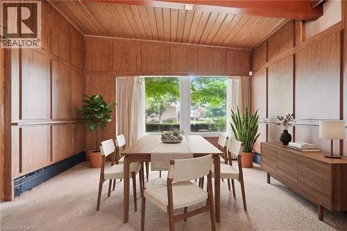 Virtually Staged -Room featuring extensive wood paneling, a wood plank ceiling, and a large picture window - 264 Mountain Brow Boulevard, Hamilton, ON - Indoor Photo Showing Dining Room