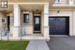 Exterior facade featuring mixed stone and stucco finishes - 