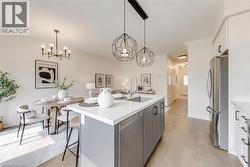 Modern kitchen island with a quartz countertop and integrated sink - 