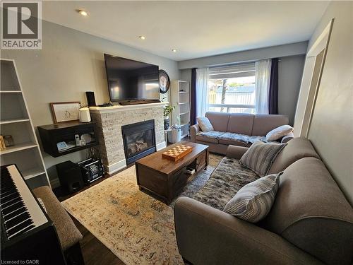 LLiving area with wood finished floors, a fireplace, and recessed lighting - 20 Bird Court, Cambridge, ON - Indoor Photo Showing Living Room With Fireplace