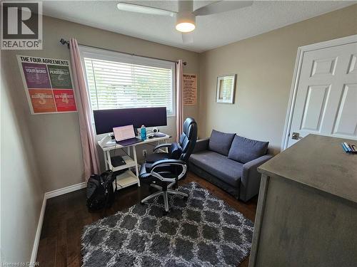 Bedroom / Office space featuring dark wood-style flooring and ceiling fan - 20 Bird Court, Cambridge, ON - Indoor Photo Showing Office