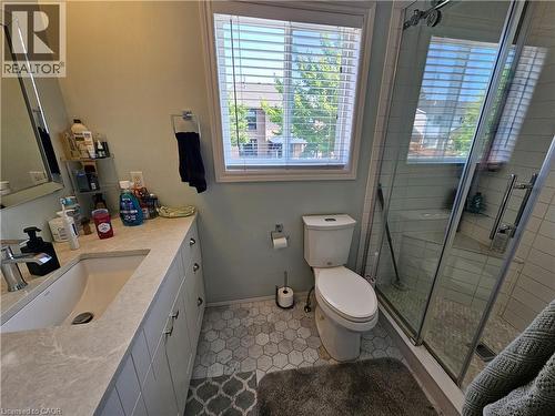 Bathroom featuring healthy amount of natural light, vanity,and a walk in shower - 20 Bird Court, Cambridge, ON - Indoor Photo Showing Bathroom