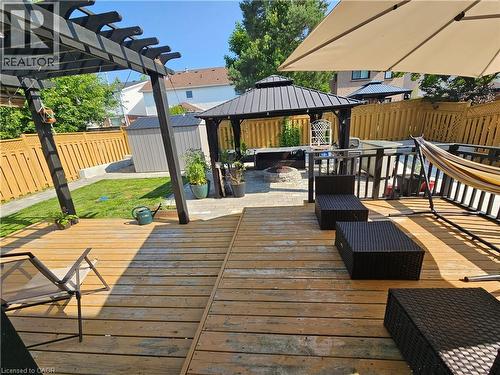 Deck with a gazebo, a natural gas fire pit connected directly to the gas line of the house , a fenced backyard, and a shed - 20 Bird Court, Cambridge, ON - Outdoor With Deck Patio Veranda With Exterior