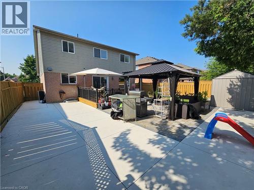 Rear view of property with a gazebo, a storage unit, a patio area, and a fenced backyard - 20 Bird Court, Cambridge, ON - Outdoor With Deck Patio Veranda