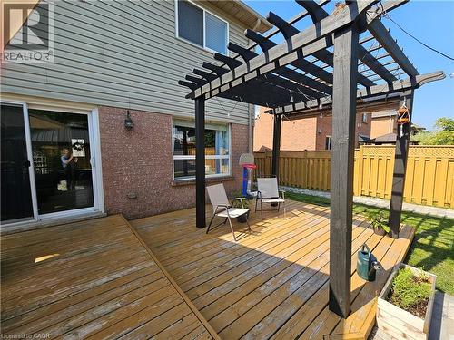 Wooden deck with a fenced backyard and a pergola - 20 Bird Court, Cambridge, ON - Outdoor With Deck Patio Veranda With Exterior