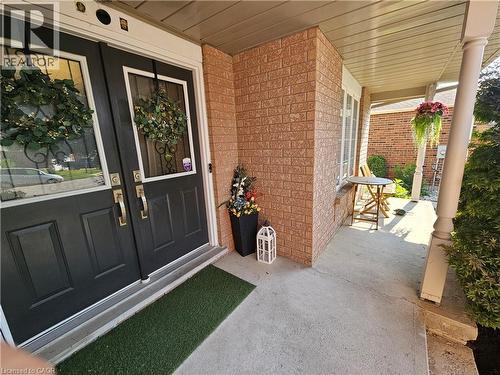 Double entrace doors at front with a covered porch - 20 Bird Court, Cambridge, ON - Outdoor With Exterior