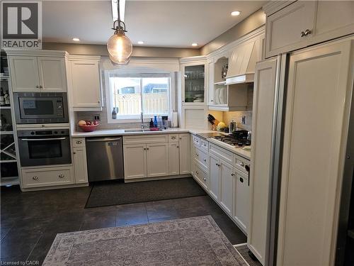 Kitchen featuring stainless steel appliances, white cabinets, light countertops, tasteful backsplash, and recessed lighting - 20 Bird Court, Cambridge, ON - Indoor Photo Showing Kitchen With Double Sink With Upgraded Kitchen