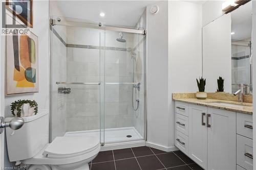 Full glass shower enclosure with a rainfall shower head, light gray tiled walls, and a white shower base - 5779 Third Line, Guelph/Eramosa, ON - Indoor Photo Showing Bathroom
