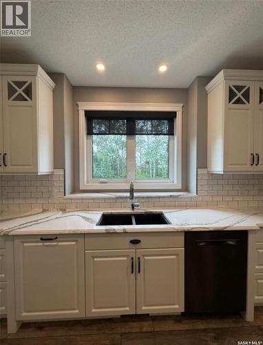 214 Hillside Drive, Tobin Lake, SK - Indoor Photo Showing Kitchen With Double Sink
