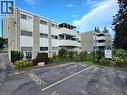 Multi-story residential building featuring brick and panel facade - 24 Mooregate Crescent Unit# 103, Kitchener, ON  - Outdoor 