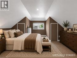 Carpeted room featuring a window with natural light, sloped ceilings, and built-in storage doors - 