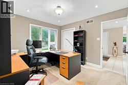 Second bedroom or office featuring large picture window and built-in closet. - 