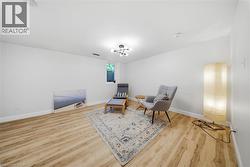 Neutral white walls with wood-finish flooring - 