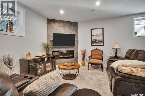 4 437 Palmer Crescent, Warman, SK - Indoor With Fireplace