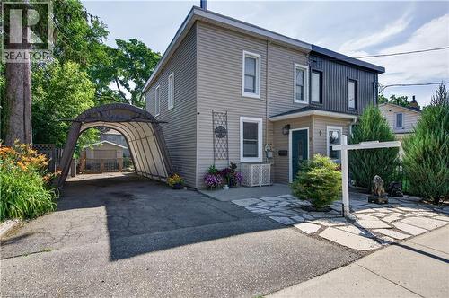Two-story residence featuring light-toned horizontal siding and dark vertical paneling - 9 Davidson Street, Cambridge, ON - Outdoor