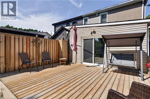 Spacious wood deck featuring privacy fencing, direct access via sliding glass doors, and light-colored siding - 9 Davidson Street, Cambridge, ON - Outdoor With Deck Patio Veranda With Exterior