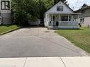 White siding exterior with a covered front porch featuring white railings - 391 Lawrence Avenue, Kitchener, ON  - Outdoor 