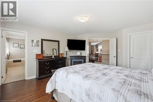 Spacious room featuring wood-finish flooring and light-toned walls - 1332 Baseline Road, Stoney Creek, ON - Indoor Photo Showing Bedroom