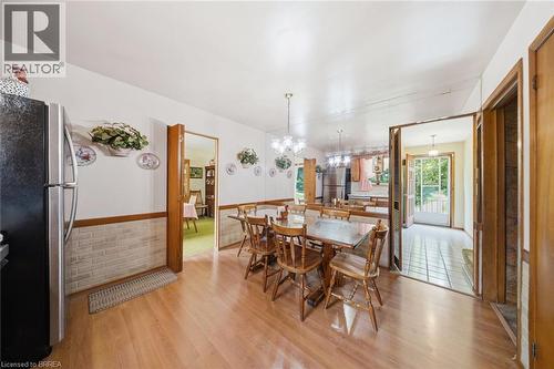 Dining space featuring wood-finish flooring and a decorative chandelier - 1598 Highway No 6, Hamilton, ON - Indoor Photo Showing Dining Room