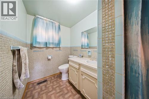Bathroom featuring a single vanity, integrated sink, and undermount cabinetry - 1598 Highway No 6, Hamilton, ON - Indoor Photo Showing Bathroom