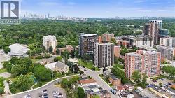 Aerial perspective showcasing a diverse urban landscape with residential buildings and abundant green spaces - 
