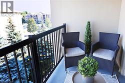 Private balcony with a sturdy black metal railing and hard-surface flooring - 