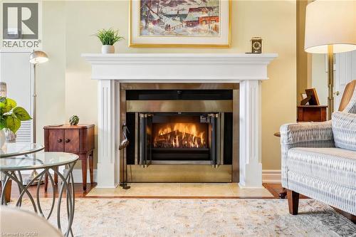 1201 North Shore Boulevard E Unit# 1003, Burlington, ON - Indoor Photo Showing Living Room With Fireplace