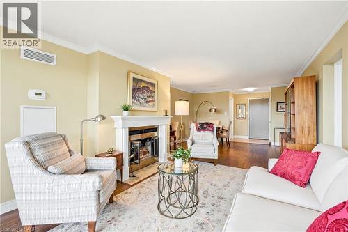 1201 North Shore Boulevard E Unit# 1003, Burlington, ON - Indoor Photo Showing Living Room With Fireplace