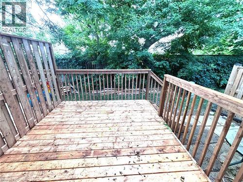 Spacious wood deck featuring a natural wood finish, complete with matching wood railings and privacy fencing - 490 Third Street Unit# 40, London, ON - Outdoor With Deck Patio Veranda
