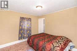 Neutral-toned walls complement the textured ceiling - 
