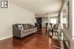 Warm wood-finish flooring extends through this open-concept living space - 