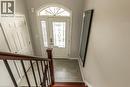 Entryway featuring a white door with decorative glass inserts, an arched transom window, and a tiled floor - 44 Lemon Grass Street, Kitchener, ON  - Indoor Photo Showing Other Room 
