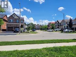 Residential street featuring paved roadways and concrete sidewalks - 