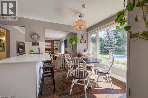 Dining area featuring wood-finish flooring and a large picture window - 41 Mcniven Road, Ancaster, ON - Indoor Photo Showing Dining Room