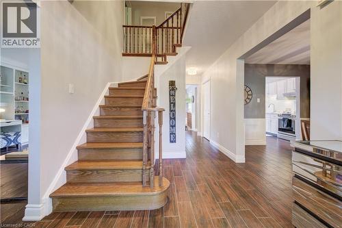 Grand entryway featuring hardwood stairs, wood-finish flooring, a two-story foyer, and an open concept design - 41 Mcniven Road, Ancaster, ON - Indoor Photo Showing Other Room