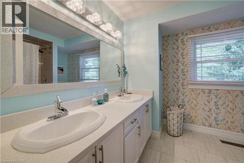 Double vanity featuring integrated sinks and polished chrome faucets - 41 Mcniven Road, Ancaster, ON - Indoor Photo Showing Bathroom