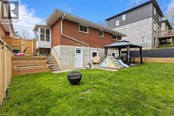 Spacious Backyard featuring new staircase and retaining walls, fully-fenced, with a gazebo and shed - 