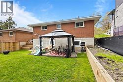 Spacious Backyard featuring new staircase and retaining walls, fully-fenced, with a gazebo and shed - 