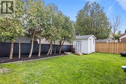 Spacious Backyard featuring new staircase and retaining walls, fully-fenced, with a gazebo and shed - 