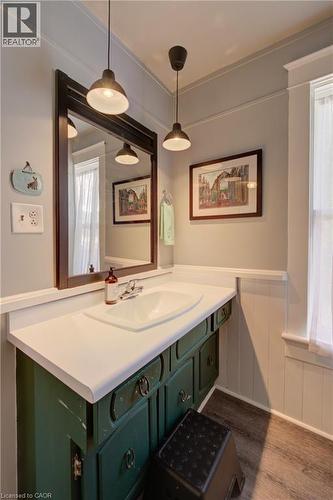 Bathroom featuring a green vanity with a white countertop and an integrated sink - 39 Kerr Street, Cambridge, ON - Indoor Photo Showing Bathroom