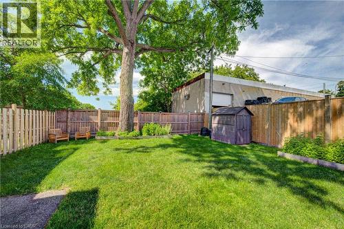 Expansive backyard featuring a large tree, a storage shed, and a privacy fence - 39 Kerr Street, Cambridge, ON - Outdoor