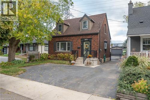 Brick exterior with dormer windows and a shingled roof - 851 Beach Boulevard, Hamilton, ON - Outdoor With Facade