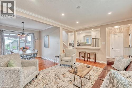 Bright living area featuring wood-finish flooring, recessed lighting, and crown molding - 851 Beach Boulevard, Hamilton, ON - Indoor Photo Showing Living Room