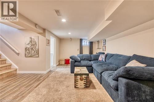 Finished lower level featuring recessed lighting, carpet flooring, wood-finish flooring, and a window with curtain - 851 Beach Boulevard, Hamilton, ON - Indoor