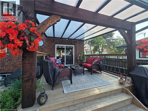 Wood-finish deck with a transparent corrugated patio cover - 851 Beach Boulevard, Hamilton, ON - Outdoor With Deck Patio Veranda With Exterior