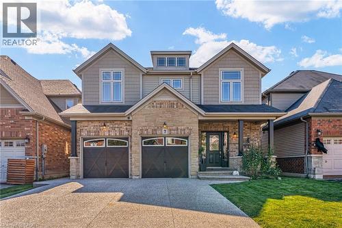 Modern two-story residence featuring a stone and siding exterior - 7 Kinsman Drive, Binbrook, ON - Outdoor With Facade