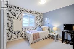 Carpeted room featuring a white paneled door, a sliding window with horizontal blinds, and a built-in wall panel - 